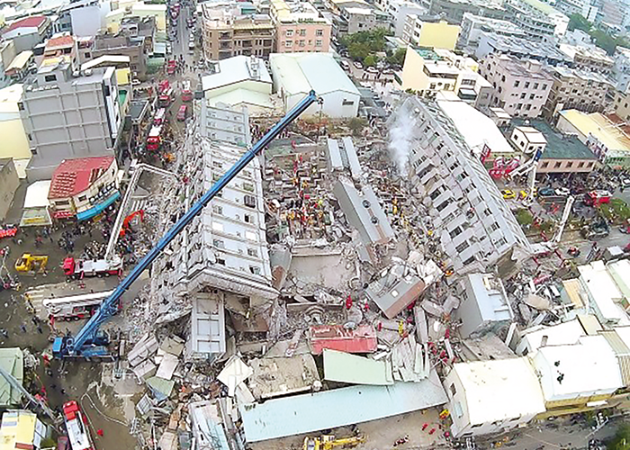 The Weiguan Jinlong residential building in Tainan after collapse. The surrounding buildings do not appear to have severe damage.